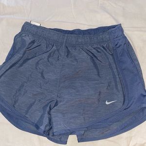 Blue Nike Dri-Fit running shorts